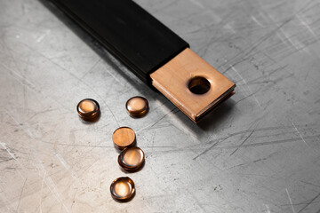 Crimping copper bus bars of power transformer connection of electrical cabinet in insulation....