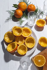Making fresh orange juice in the kitchen