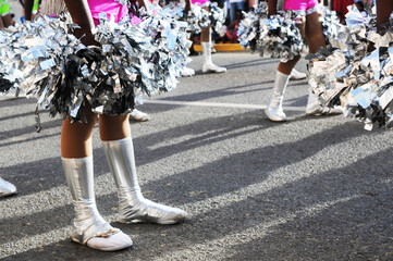 Silver boots of majorettes and pompoms.