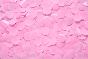 Many pink confetti as background, top view