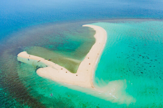 Atoll with an island of white sand.