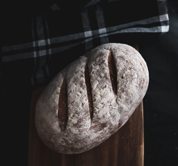 loaf of Sourdough bread topped with flour 