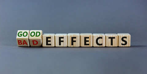 Bad or good effects symbol. Turned wooden cubes and changed words 'bad effects' to 'good effects'. Beautiful grey background. Business and good effects concept. Copy space.