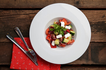 Salad with cheese, cucumber, red pepper and olives