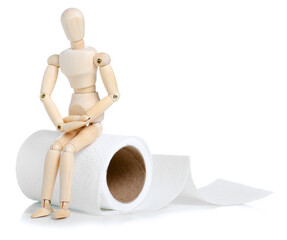 Wooden man mannequin figure with roll of toilet paper on white background isolation. Concept of the...