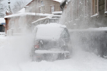 Snow from the roofs fell on the car