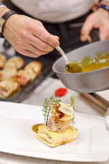 italian chef making gourmet dish