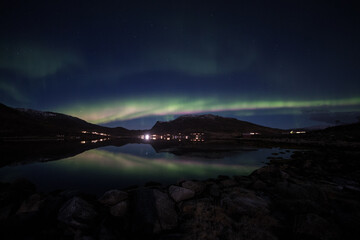 Aurora reflections in the fjord outside Tromso