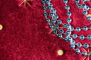 Happy New Year. Red background. Silver decorations for the Christmas tree.