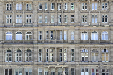 several windows in a classic building