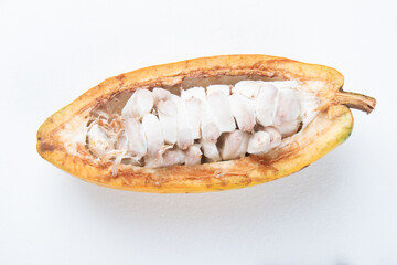 Ripe cocoa fruit cut on white background