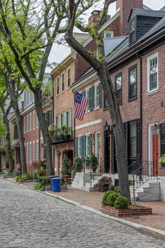 Philadelphia street scene in historical Society Hill section of the city.  Showing colonial homes on a cobblestone street.