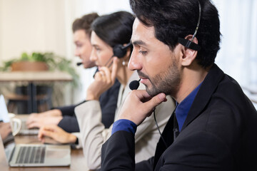 Side View of Telemarketing Colleagues with Headset Talking with Their Clients