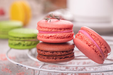 colorful macarons over on black background.  Selective focus