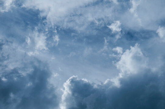 Dramatic dark blue sky with heavy clouds background