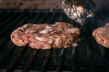 steel grilled meat burger with wood flame fries in metallic foil herbs oregano cordoba argentina