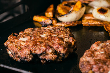 steel grilled meat burger with wood flame fries in metallic foil herbs oregano cordoba argentina