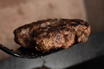 steel grilled meat burger with wood flame fries in metallic foil herbs oregano cordoba argentina