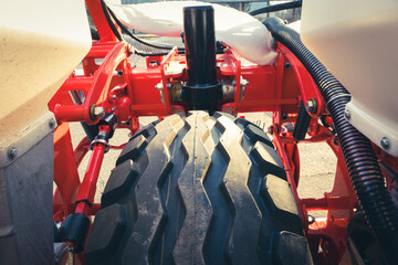 Close-up of a wheel protector on an agricultural seeder.