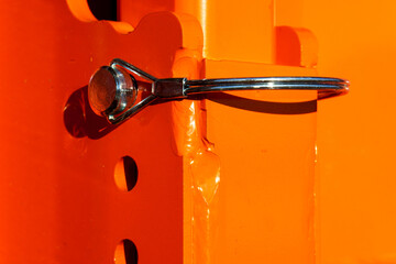A close-up of a cotter pin for an agricultural seeder.