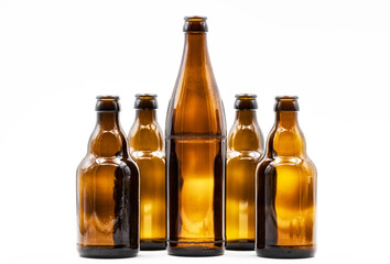 A row of empty brown bottles