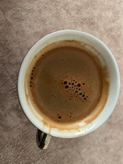 Turkish Traditional drink and Turkish coffee, coffee foam, top view.
