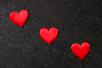 St. Valentine day background. Red heart on dark background