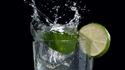 Mojito drink with splash, closeup