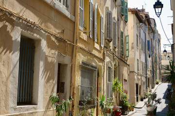 Fototapeta na wymiar Narrow street with old houses in Marseille, France