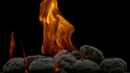 Burning charcoal isolated on black background