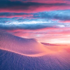 Foto op Canvas Fantastic winter landscape in snowy mountains glowing by morning sunlight. Dramatic wintry scene with frozen snowy hills at sunrise. Christmas holiday background © Ivan Kmit