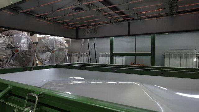 The thermoforming machine. Make a shape or detail. Production at the factory. The process of thermal vacuum forming. Production of three-dimensional plastic parts.