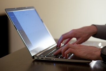 hands and laptop keyboard