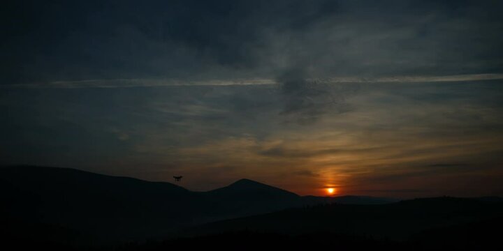 Timelaps sunrise in mountains. video about the movement of the sun over the mountains