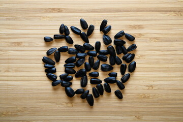 Sunflower seeds on a bamboo board