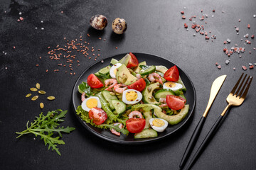 Salad with shrimp, avocado, cucumber, pumpkin seeds and flax seeds with olive oil