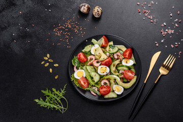 Salad with shrimp, avocado, cucumber, pumpkin seeds and flax seeds with olive oil