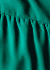 close up of a green satin dress