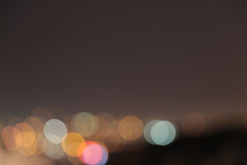 Cityscape bokeh. Blurred photo. Glowing lights