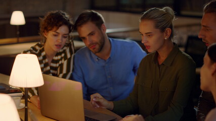 Young girl saying goodbye to team in office. People analyzing data on laptop.