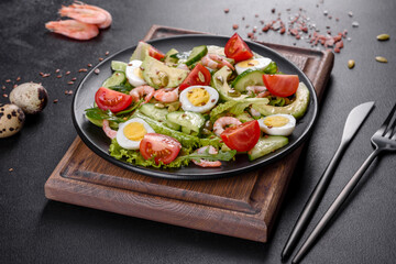 Salad with shrimp, avocado, cucumber, pumpkin seeds and flax seeds with olive oil