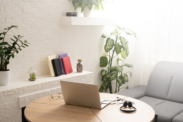 design of workplace with laptop in home office