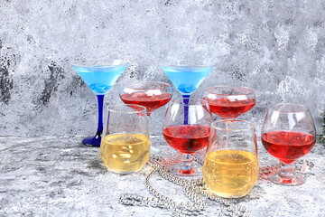 Assortment of alcoholic cocktail with lemonade, wine, champagne, grog or martini in glasses on a...