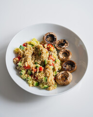 Quinoa salad with vegetables and grilled mushrooms