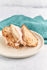 homemade club sandwich with ham on the board