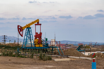 Fototapeta na wymiar Oil pump. Oil industry equipment. Petroleum industry in Azerbaijan. Baku petrol station