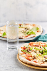 Homemade stone and mold pizzas with fresh vegetables and muzzarella