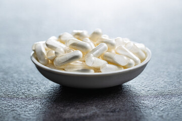 White medical pills. Pharmaceutical medicine pills, tablets and capsules.