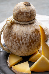 Italian semi hard matured caciocavallo cheese, handmade and aged in natural underground caves in...