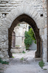Fototapeta na wymiar Old buildings and narrow streets in medieval town Villeneuve les Avignon in summer